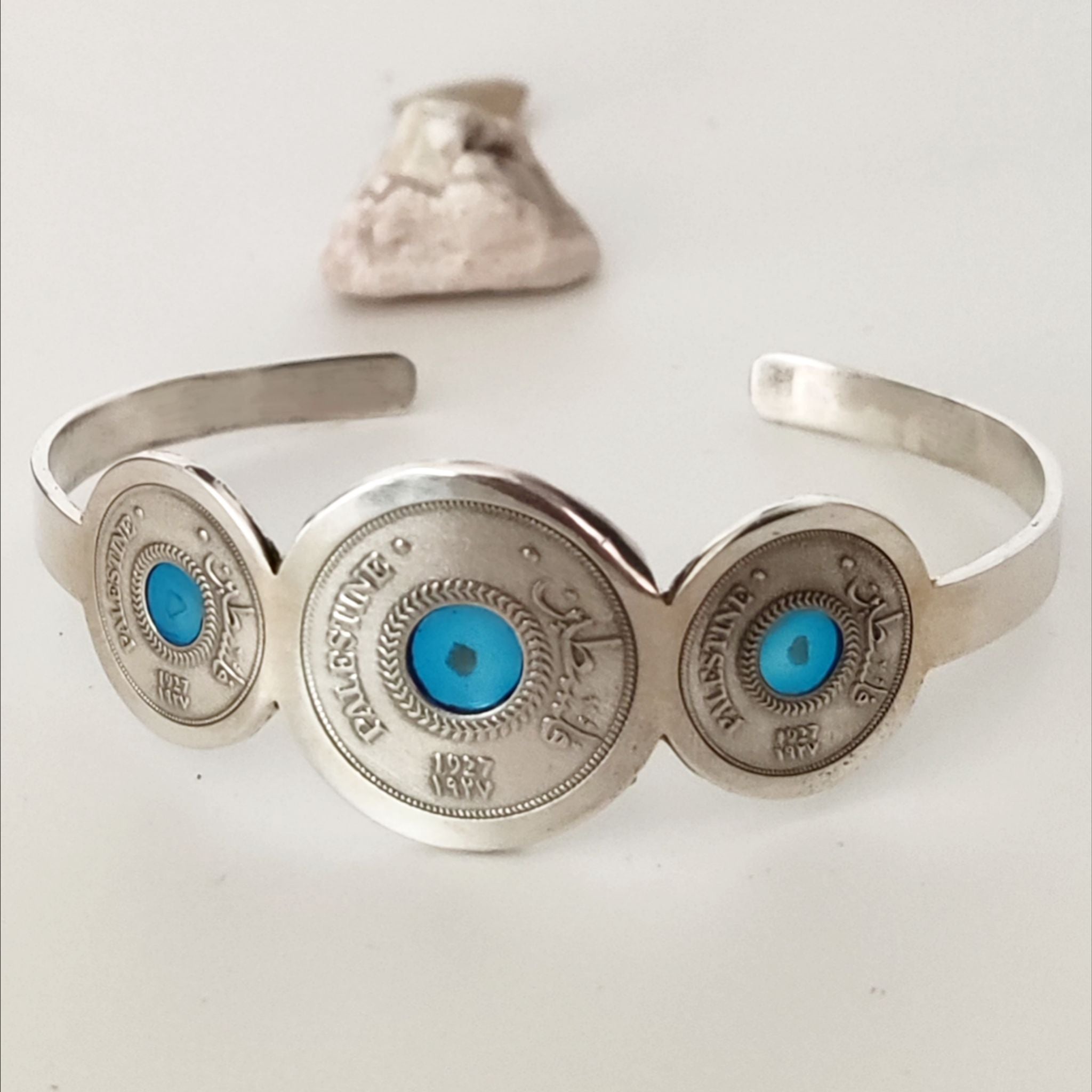 Silver Palestine Coin Bracelet inspired by the 1927 5 Mils coin, with stones from Palestinian cities