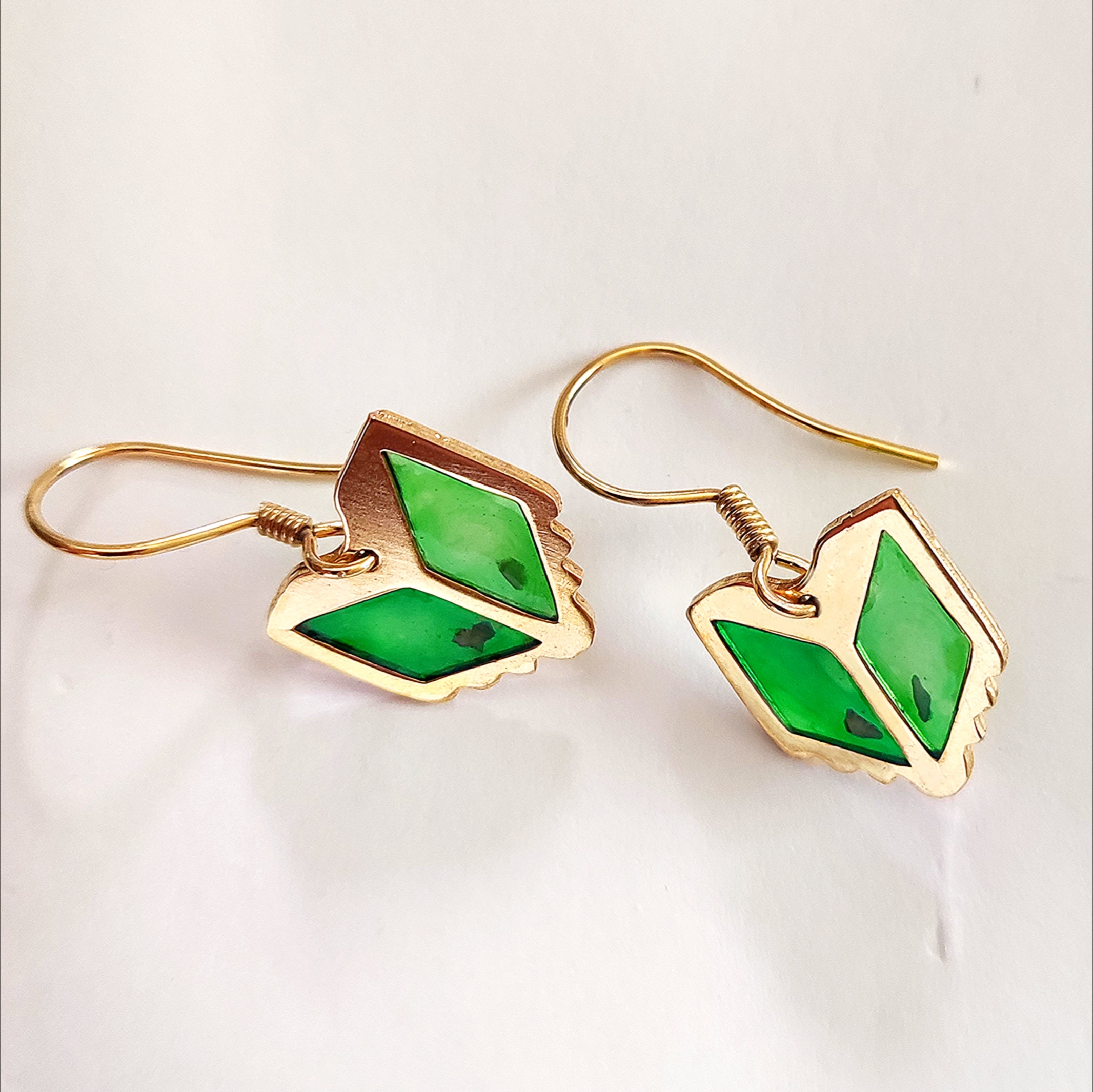 Tatreez embroidery earrings in silver. Handmade in Palestine. Palestinian jewelry brand company