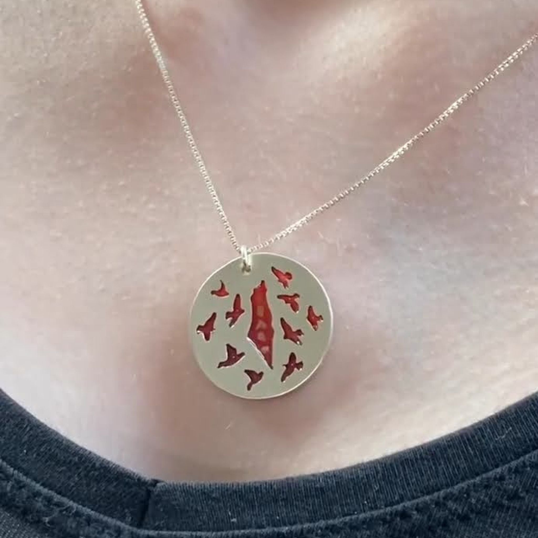 Silver Return Necklace with birds circling the map of Palestine, handmade in Ramallah