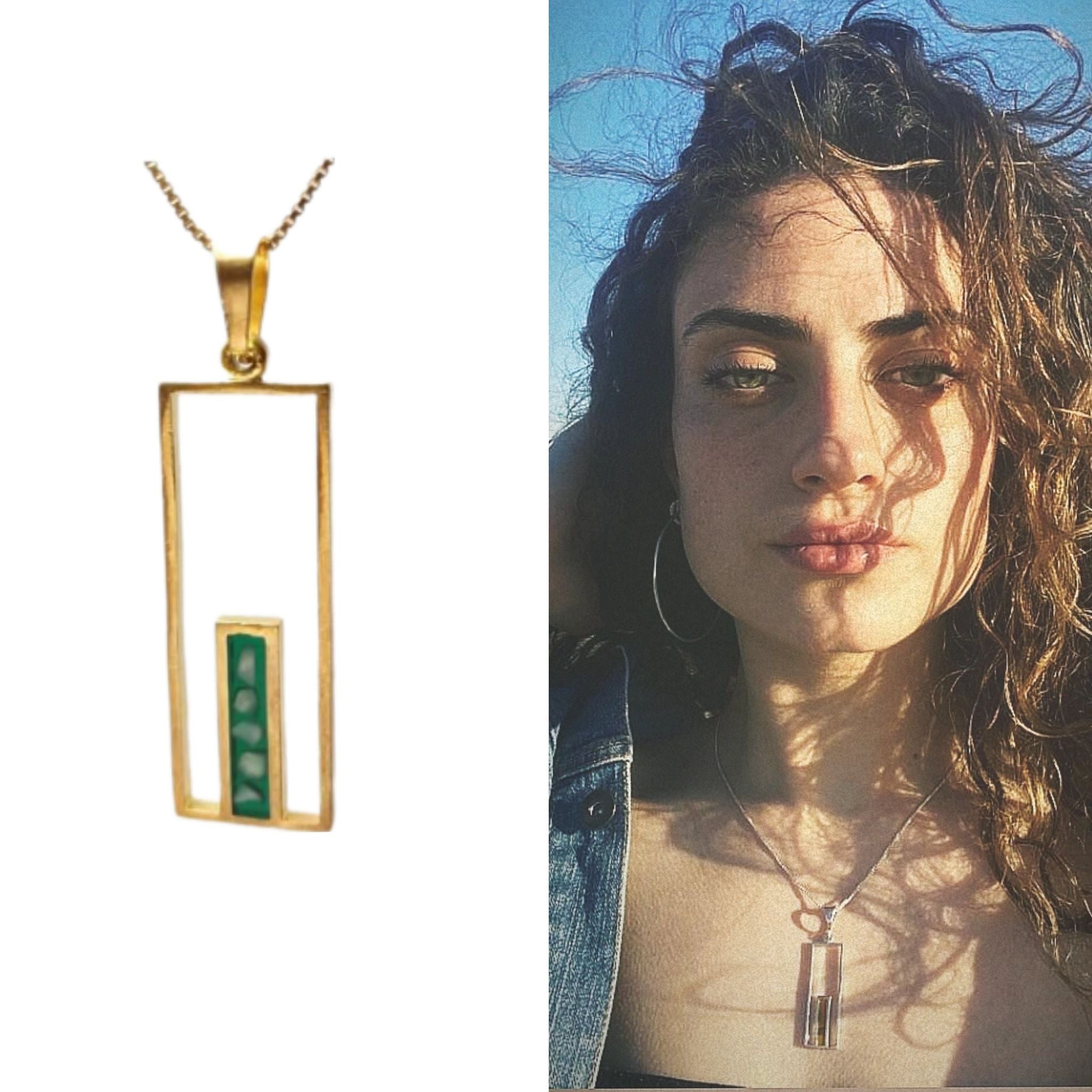 Woman wearing the Jerusalem Gate Necklace, showing how it sits when worn