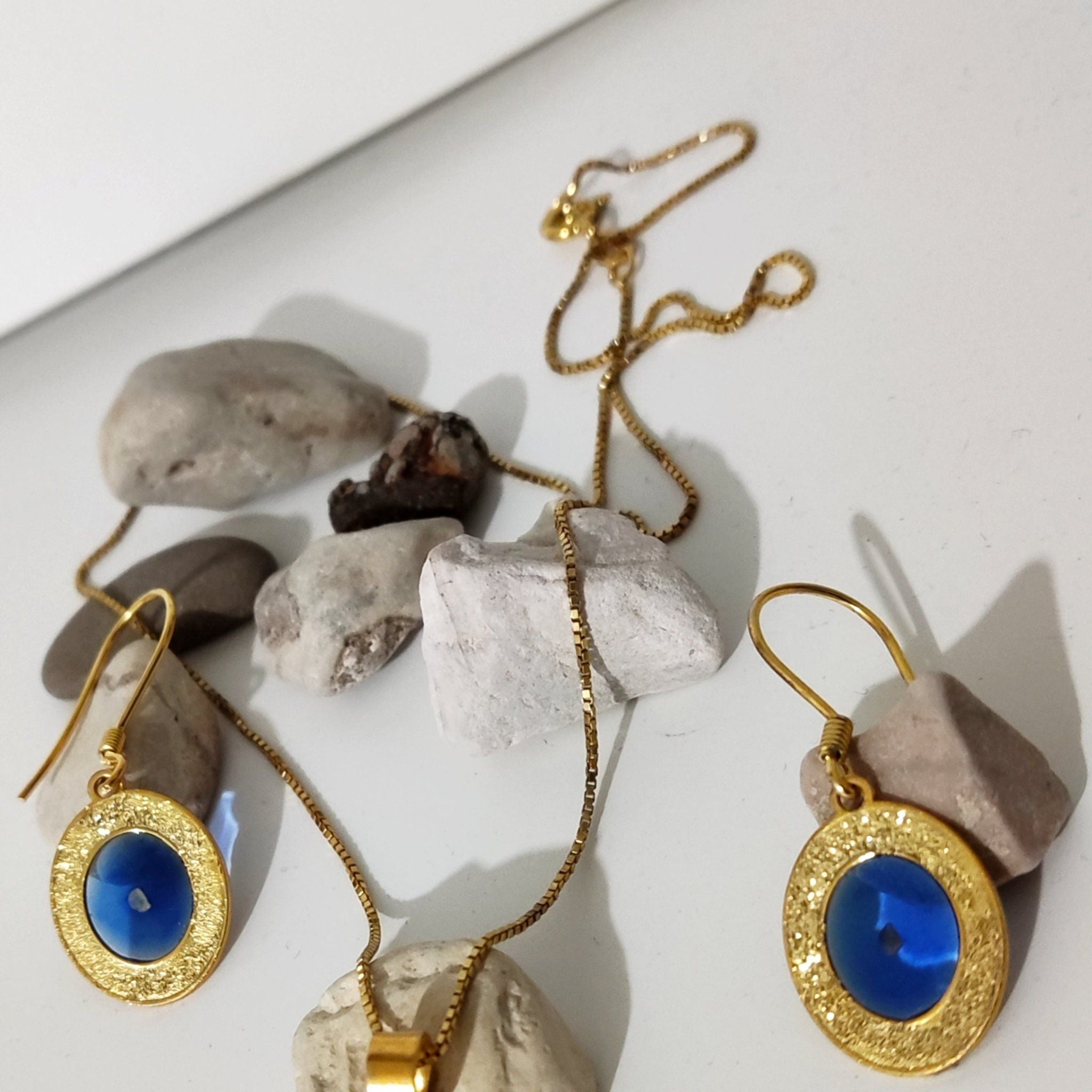 Silver Moon Earrings, crescent design holding a stone from a Palestinian city, handmade in Ramallah