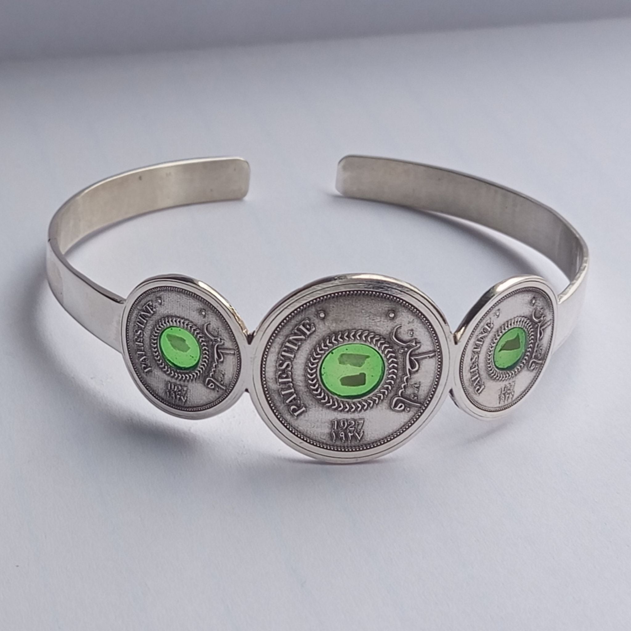 Silver Palestine Coin Bracelet inspired by the 1927 5 Mils coin, with stones from Palestinian cities